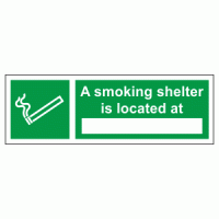 A smoking shelter is located at sign