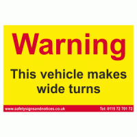 Warning This vehicle makes wide turns sign