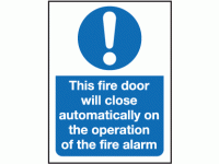 This fire door will close automatical...