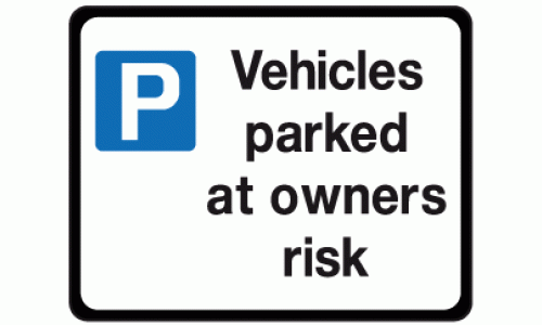 Vehicles parked at owners risk sign