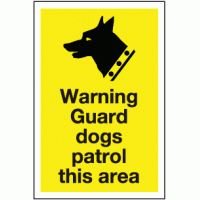 Warning guard dogs patrol this area sign